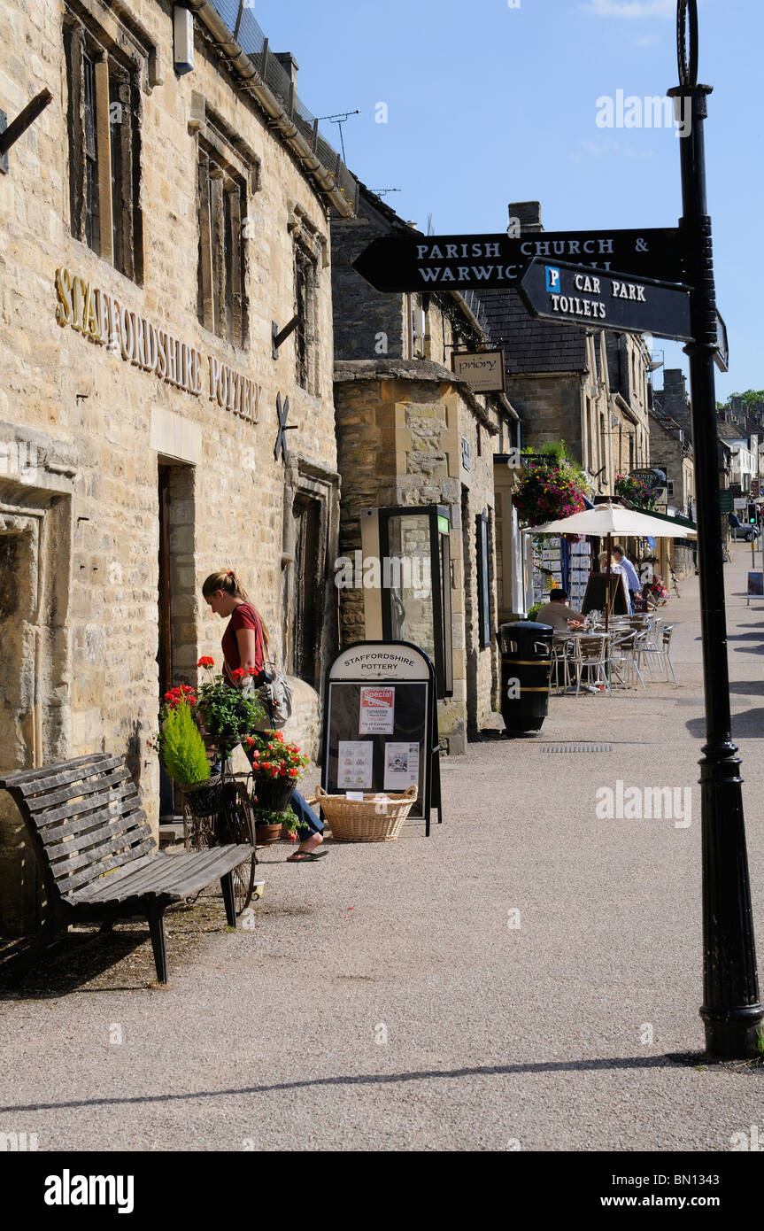 Cotswold stone buildings on the High Street Burford Oxforshire known as the gateway to the Cotswolds a popular tourist region UK Stock Photo