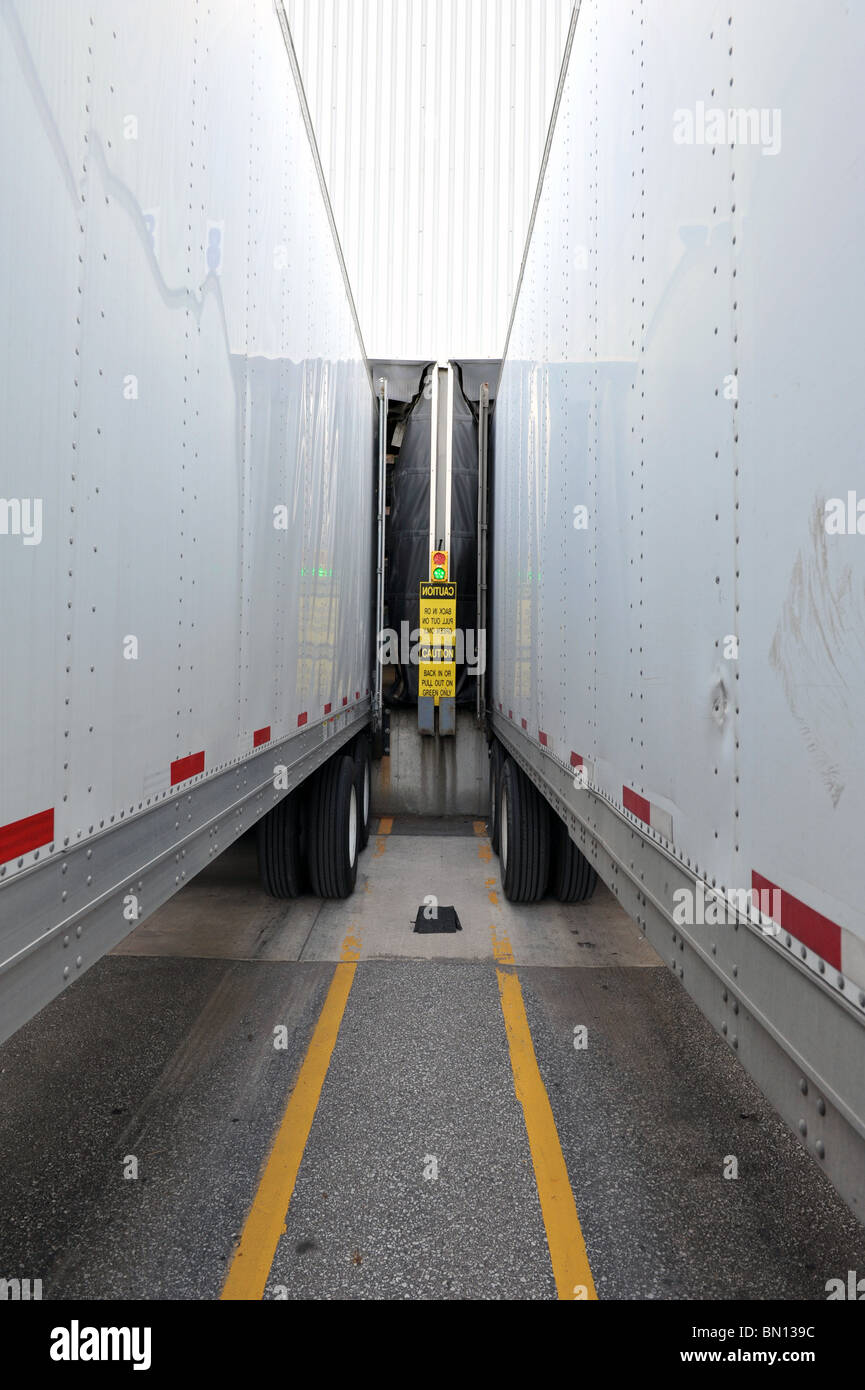 Trailers backed into a dock Stock Photo Alamy