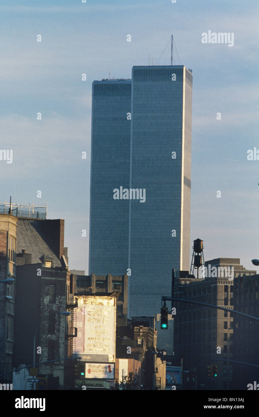 Glossy, gleaming, the twin towers of the World Trade Center once stood tall over less glamorous areas in Lower Manhattan Stock Photo