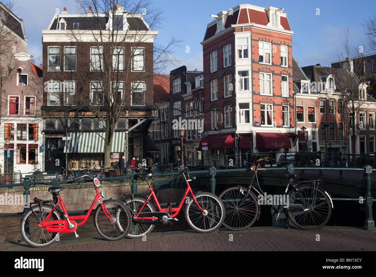 Canal houses and bikes in the city of Amsterdam Stock Photo
