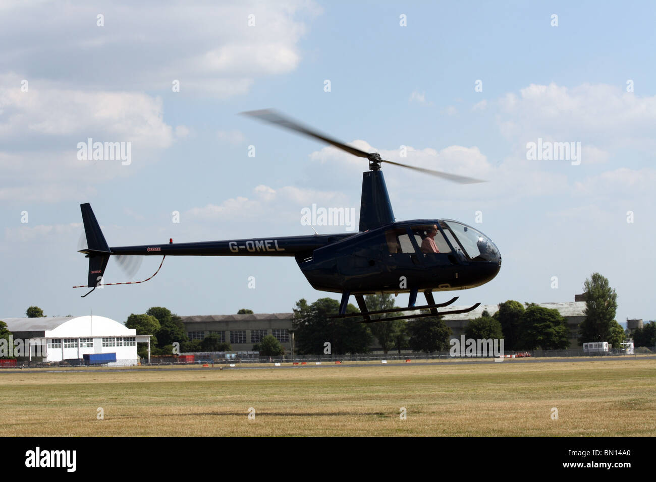 Robinson R22 helicopter landing at Kemble Airfield Stock Photo