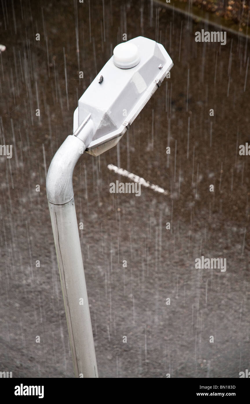 Streetlamp seen from above in the rain Stock Photo