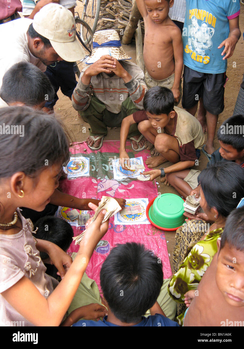villagers gambling at game, Kompong Phluk village, Tonle Sap Lake, Cambodia Stock Photo