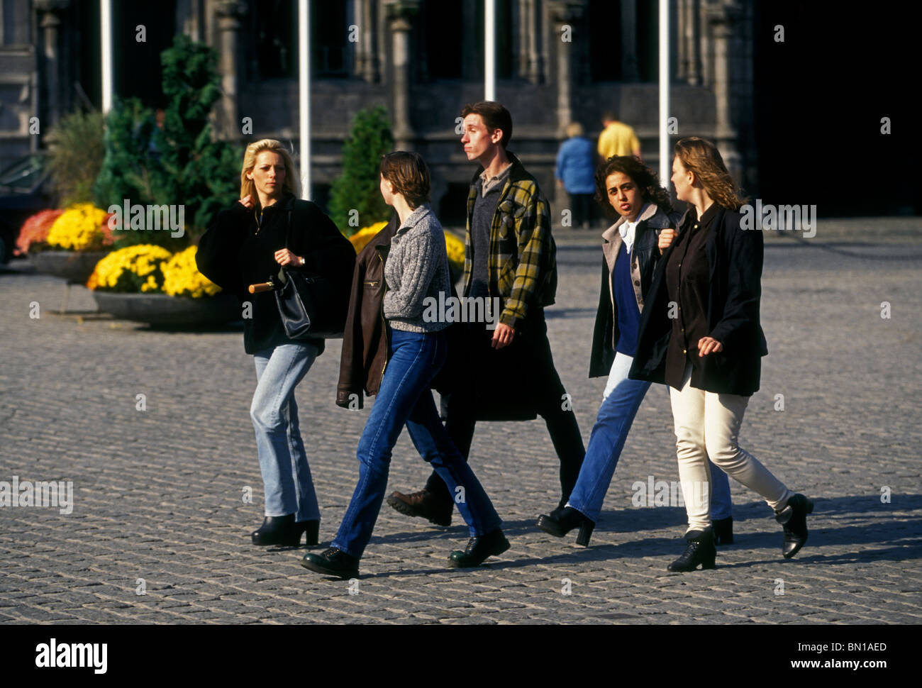 Belgian people young adult men women college students walking in Grand  Place city of Mons Walloon Region Belgium Europe Stock Photo - Alamy