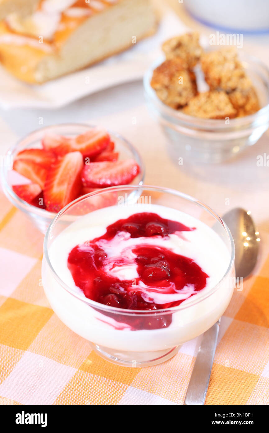 Healthy breakfast or snack with yogurt, pound cake and fresh fruits Stock Photo