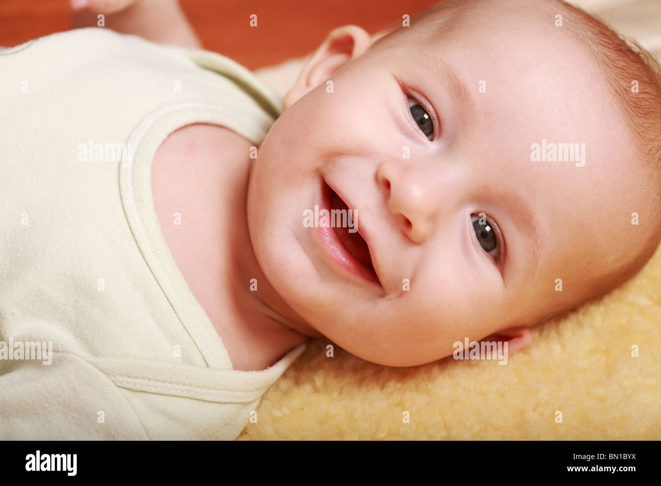 Portrait of cute newborn laughing Stock Photo Alamy