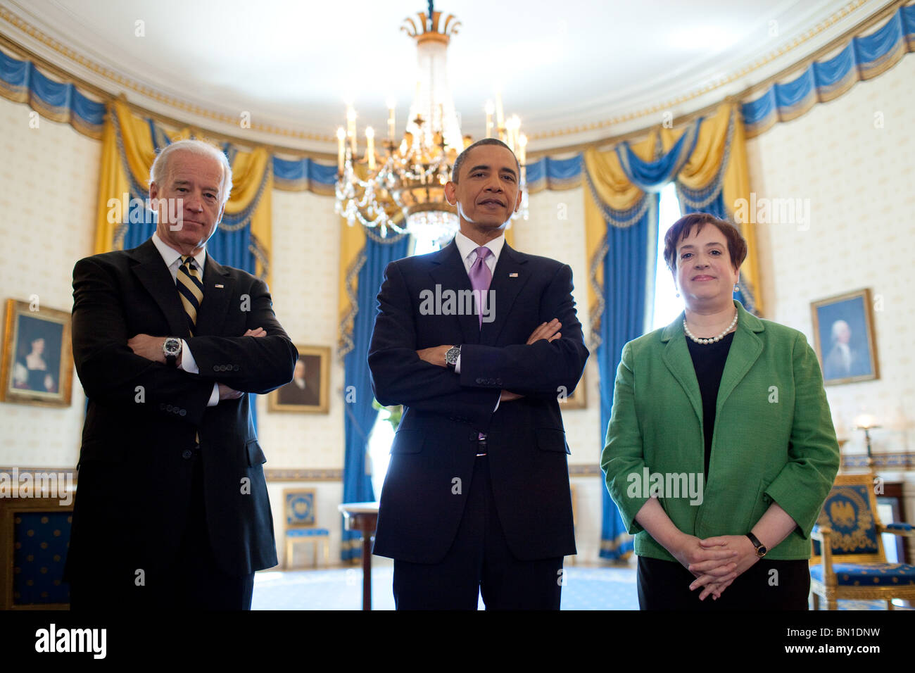 President Barack Obama and Vice President Joe Biden stand with Solicitor General Elena Kagan in the Blue Room of the White House Stock Photo
