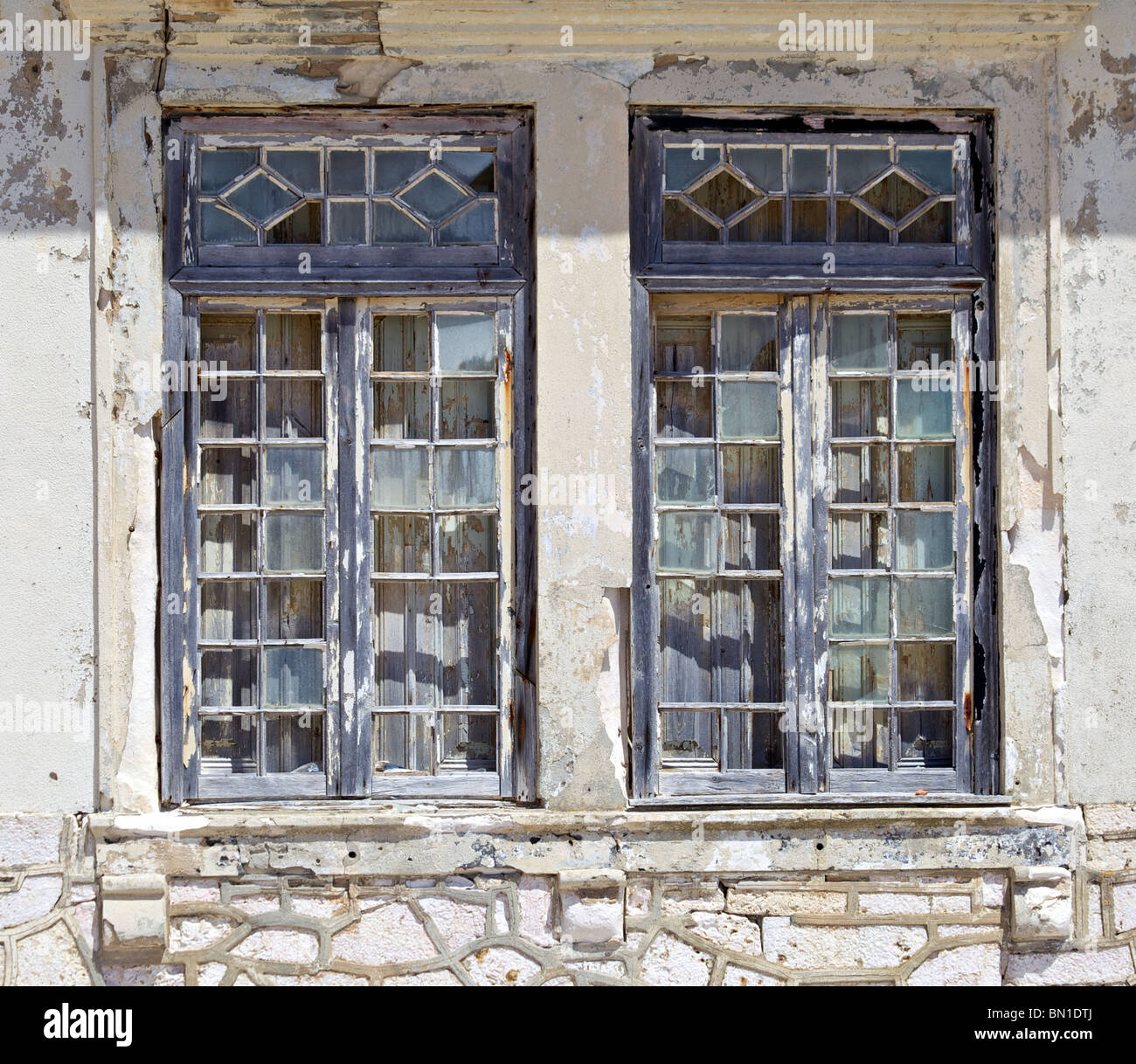 Broken Rustic Faded Painted Wood Windows of Old World Europe Stock Photo