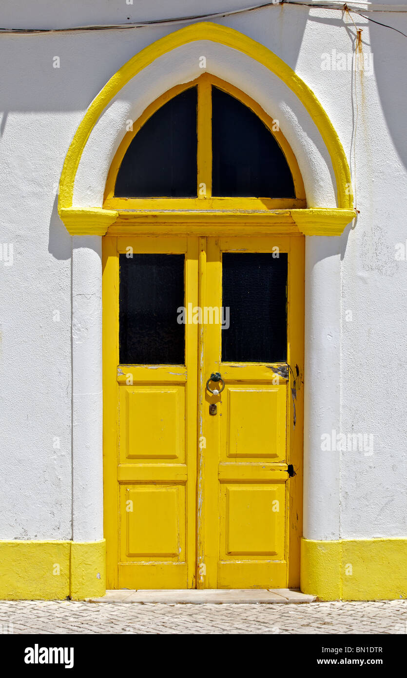 Bright Painted Yellow Wood Door of Old World Europe Stock Photo