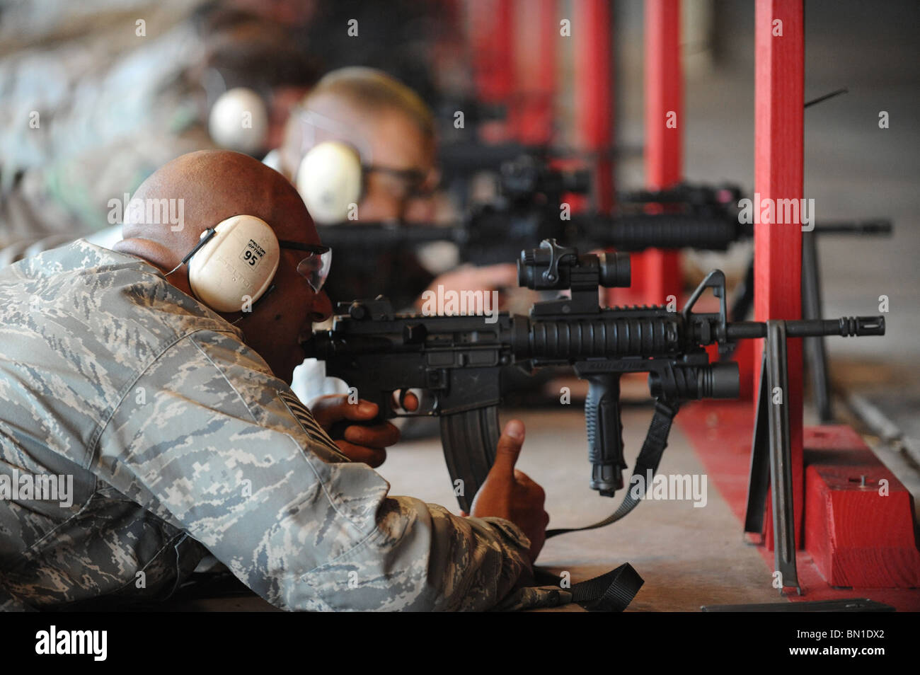 Tech. Sgt. Antonio Frese takes aim with an M-4 rifle Stock Photo
