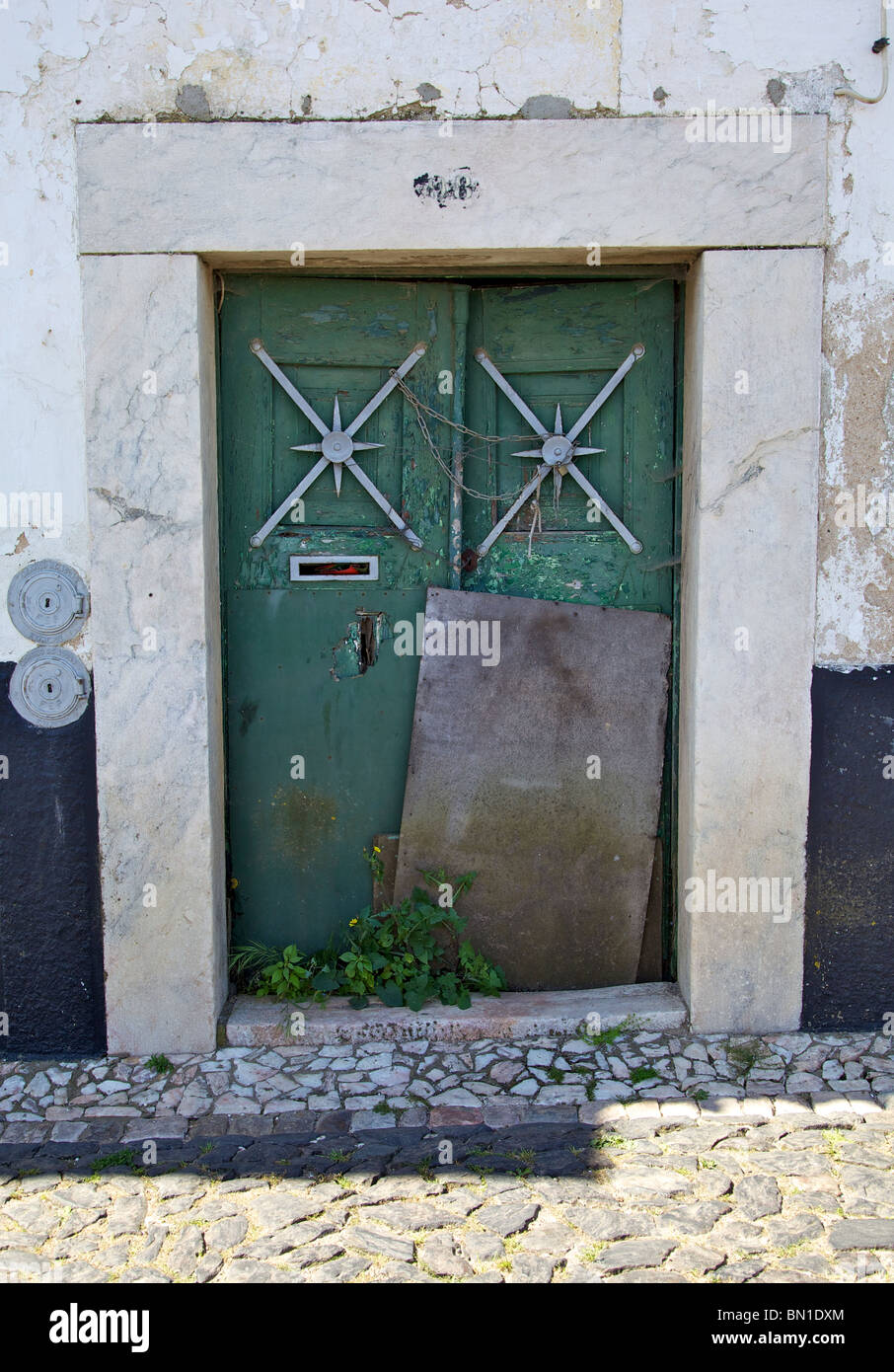 Green Rustic Faded Wood Door of Old World Europe Stock Photo