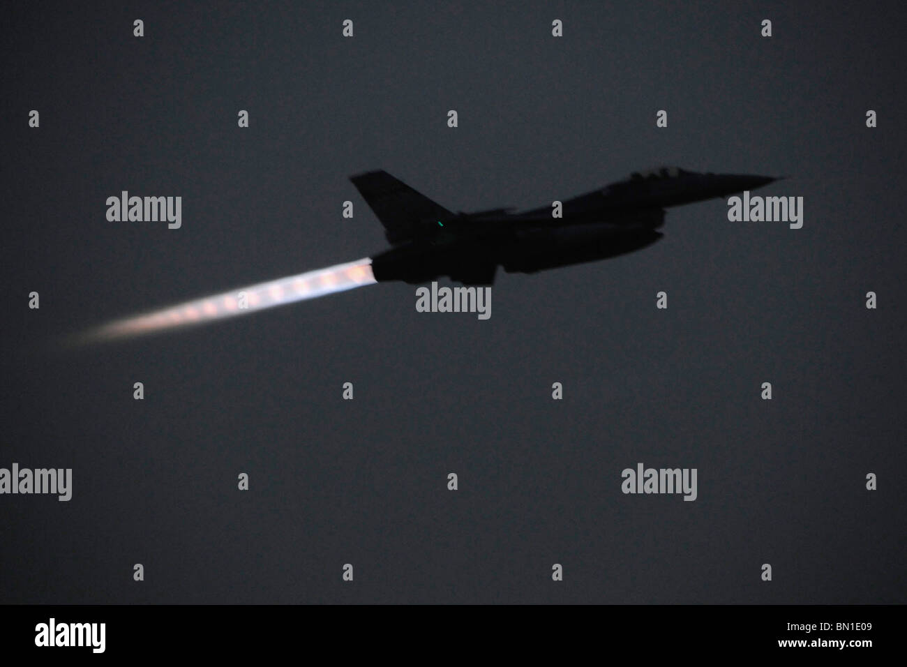 An F-16 Fighting Falcon takes off for a night mission from Joint Base Balad, Iraq, May 24, 2010. Stock Photo