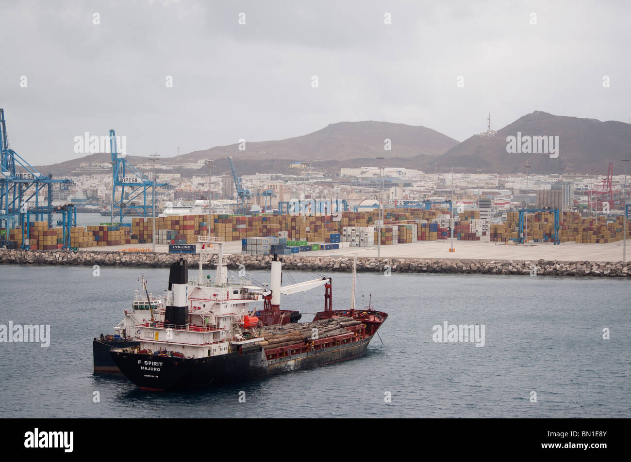 The F Spirit Cargo Ship anchored. In the background shipping containers are stored in the harbour of Gran Canaria, Spain. Stock Photo