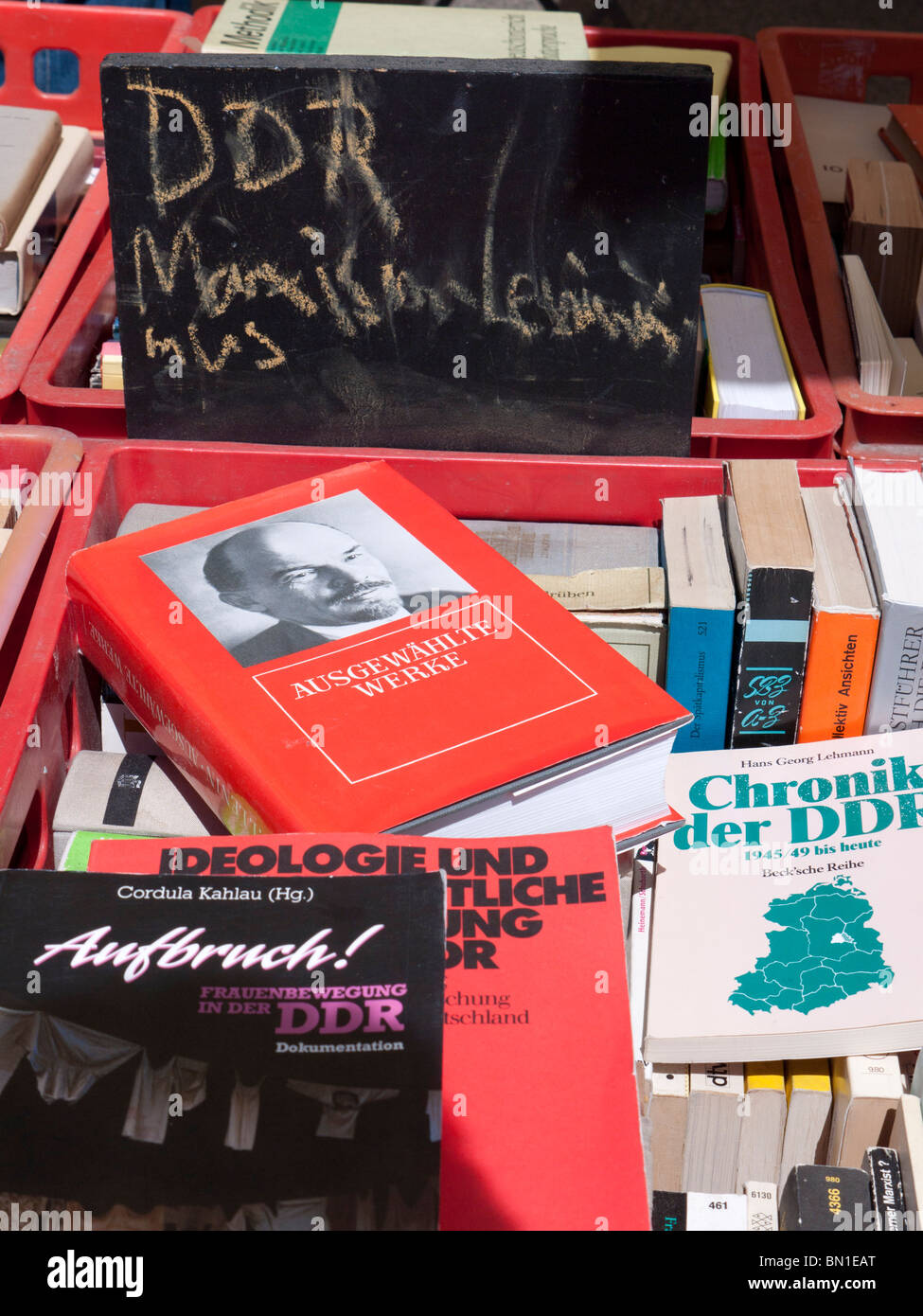 Secondhand books about the former communist DDR for sale at bohemian cafe and bookshop Tasso on Karl Marx Allee in former East B Stock Photo