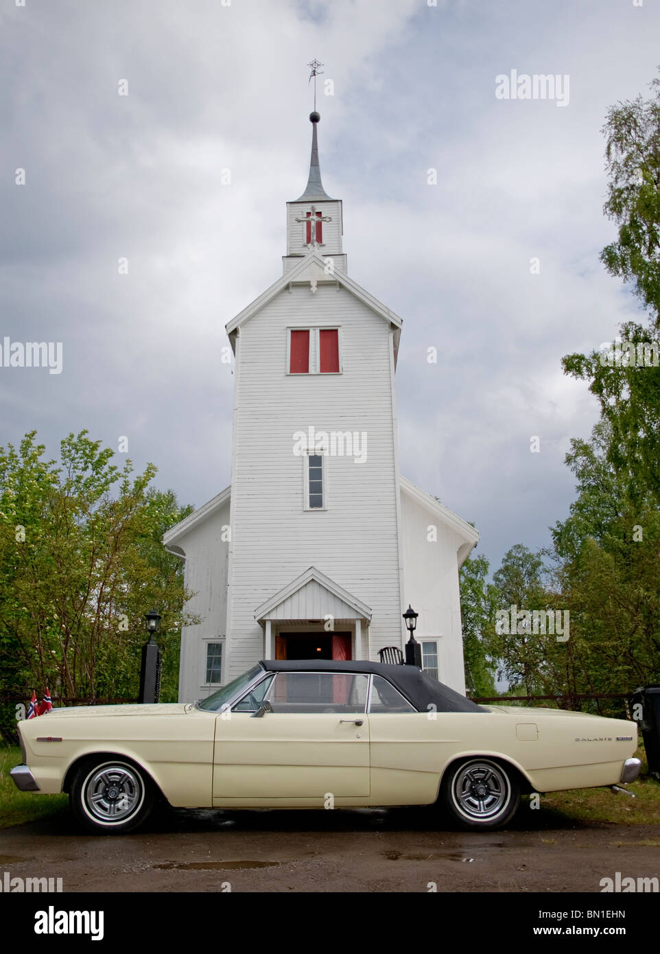 A 1966 Ford Galaxie 500 parked outside a church used as a wedding car Stock Photo
