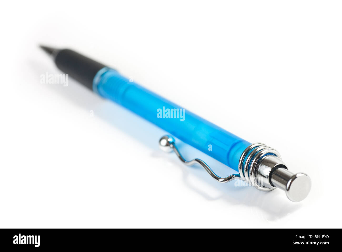 A closeup of a blue pen, focus on one end, isolated on white. Stock Photo