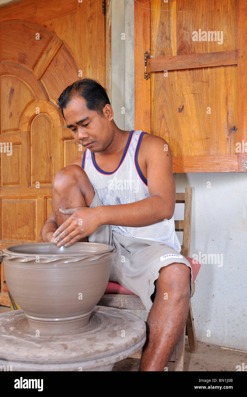 Pottery is an ancient craft in north-east Thailand. Farmers use it as extra income beside rice farming. Stock Photo