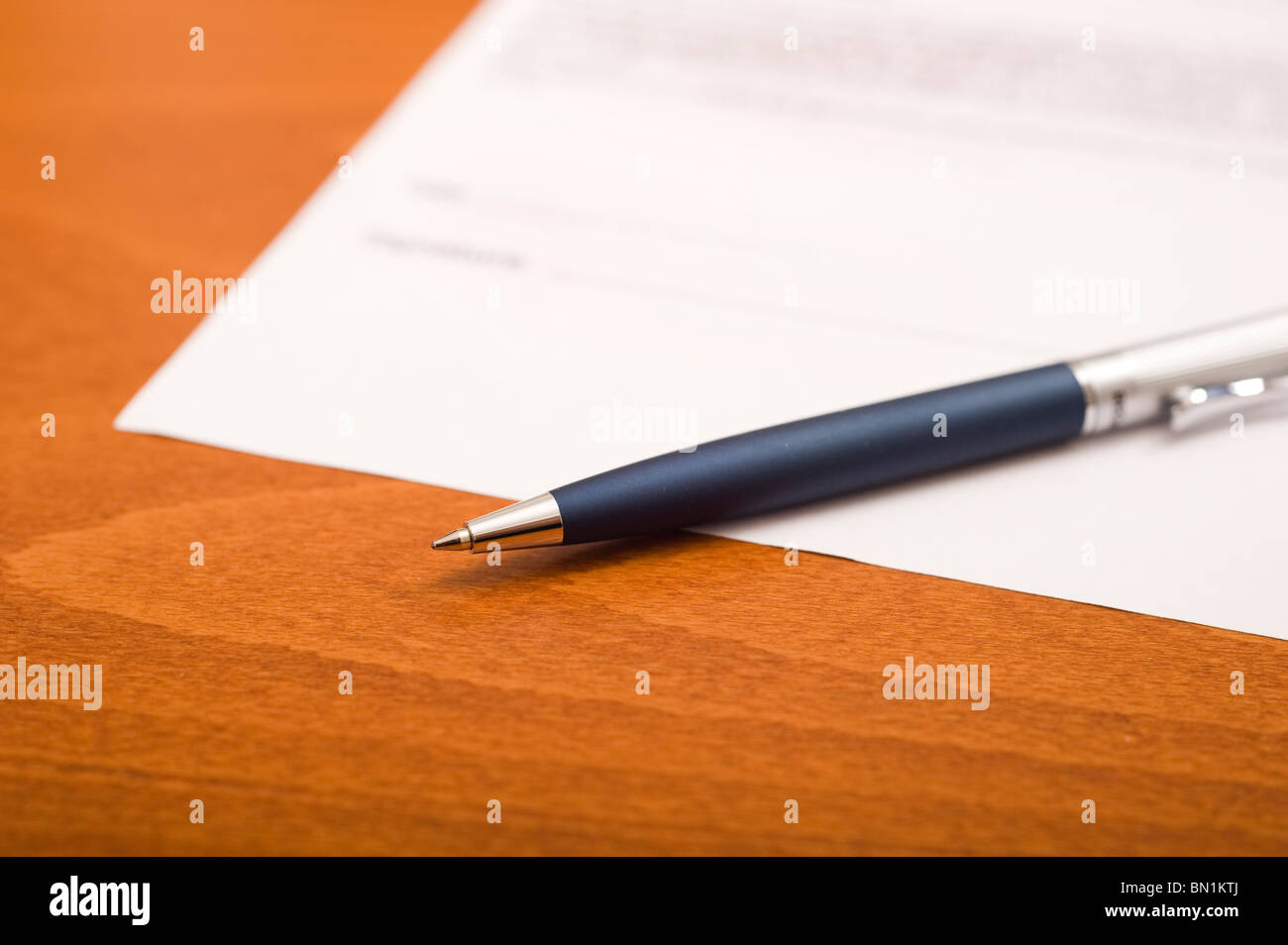 pen and a blank contract on a table, ready to be signed Stock Photo