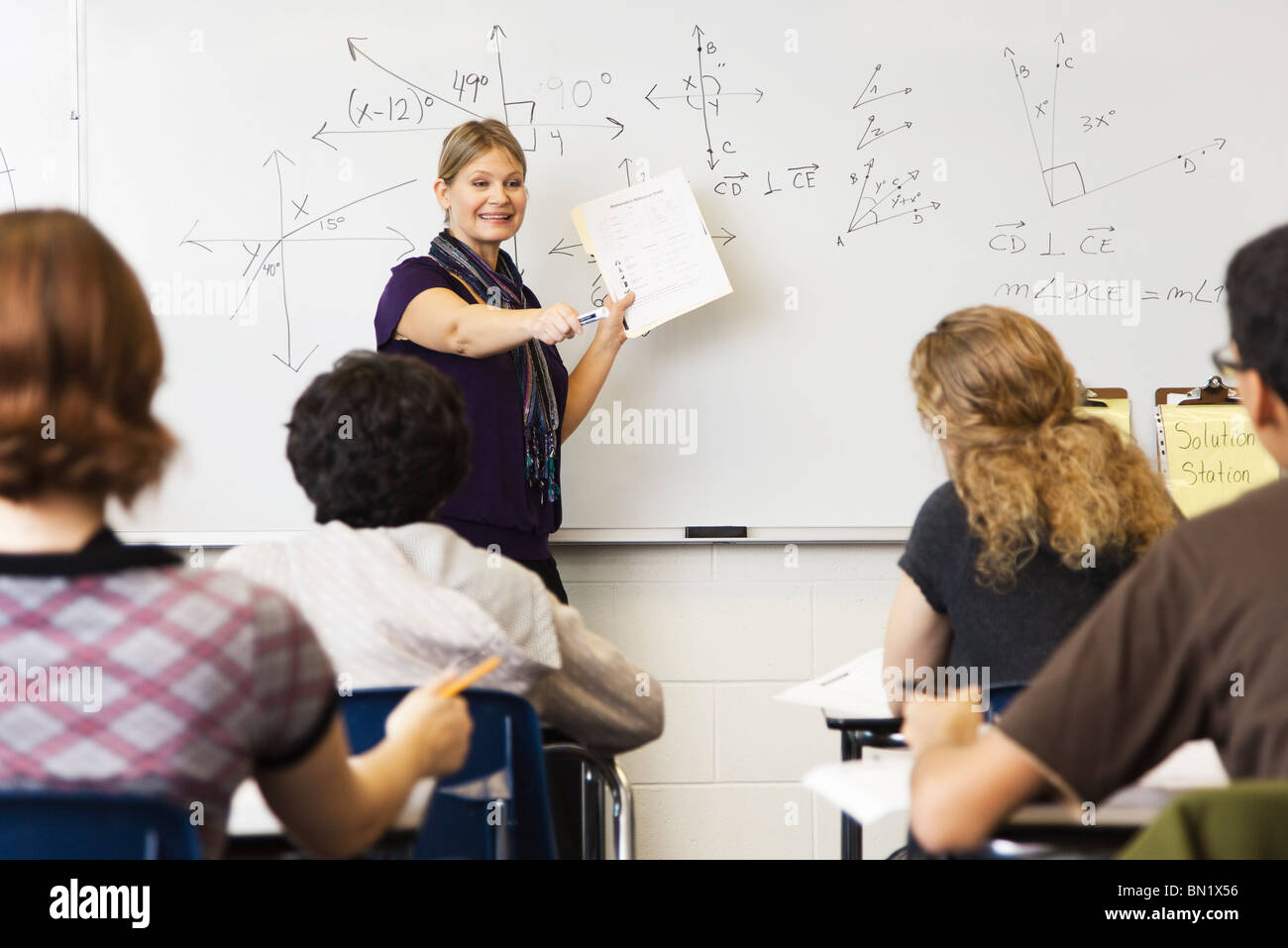 Woman teaching geometry class Stock Photo