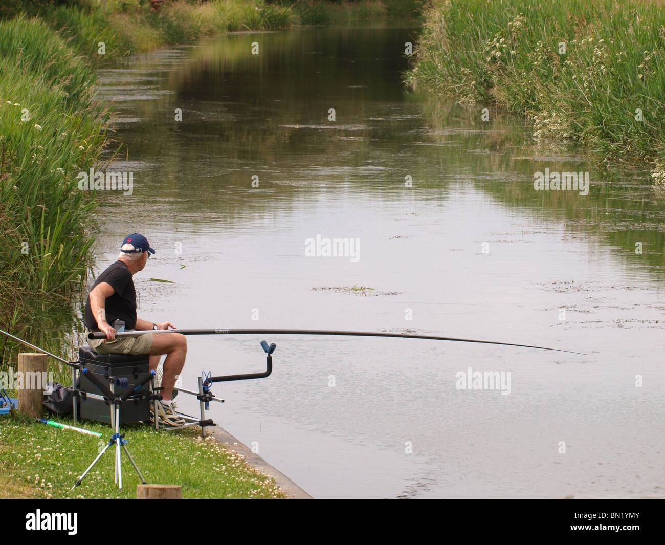 Man pole fishing, Bude Canal, Cornwall, UK Stock Photo - Alamy