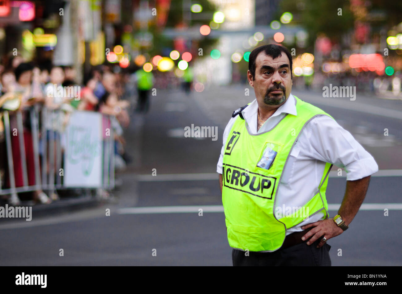 Security guard on duty at an evening / night event Stock Photo