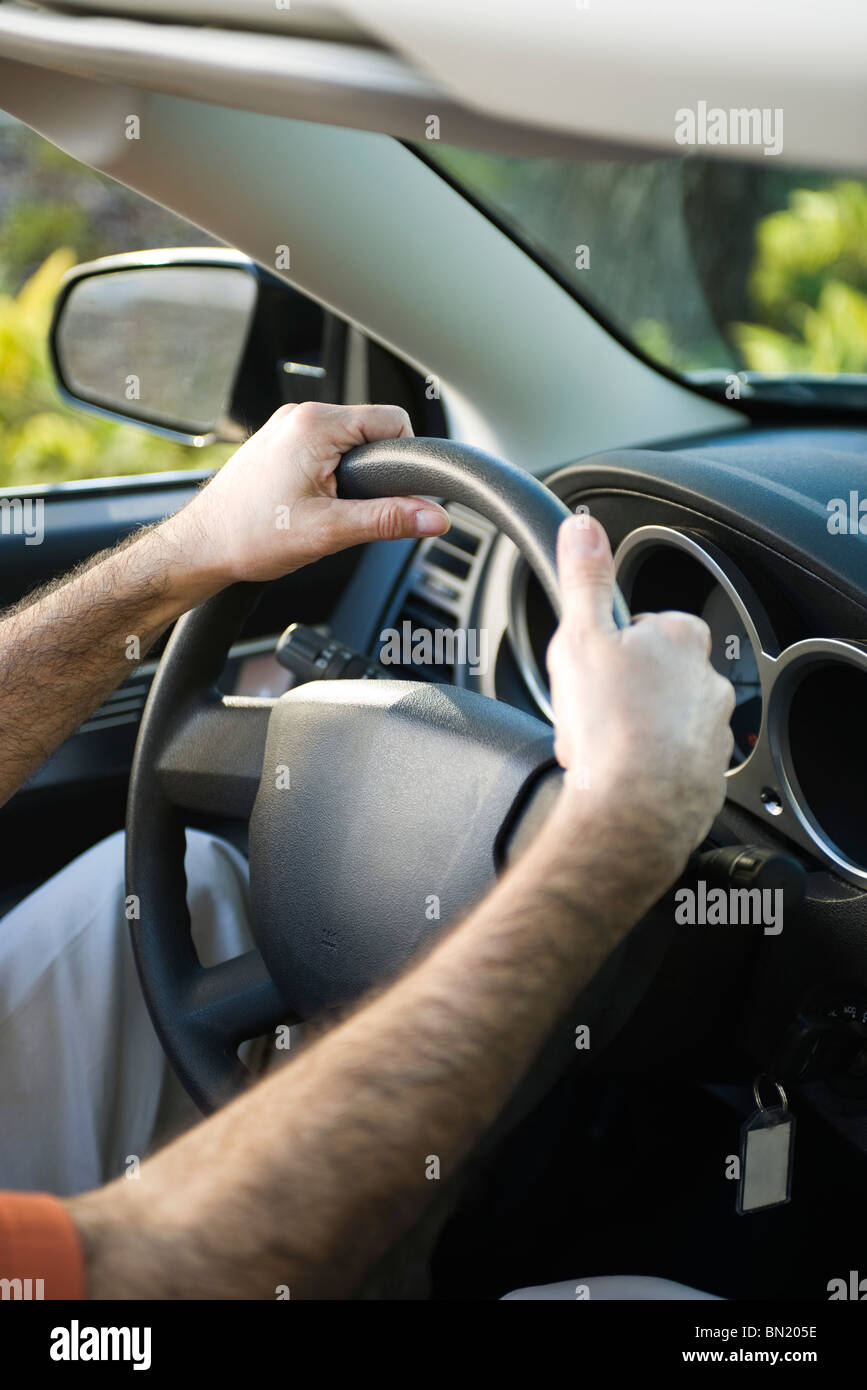 Driving car with both hands on the steering wheel Stock Photo Alamy