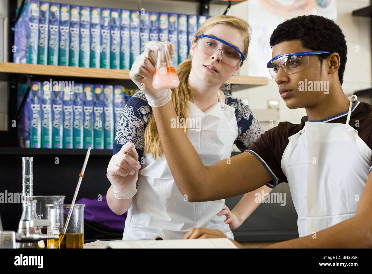 High school students conducting experiment in chemistry class Stock ...