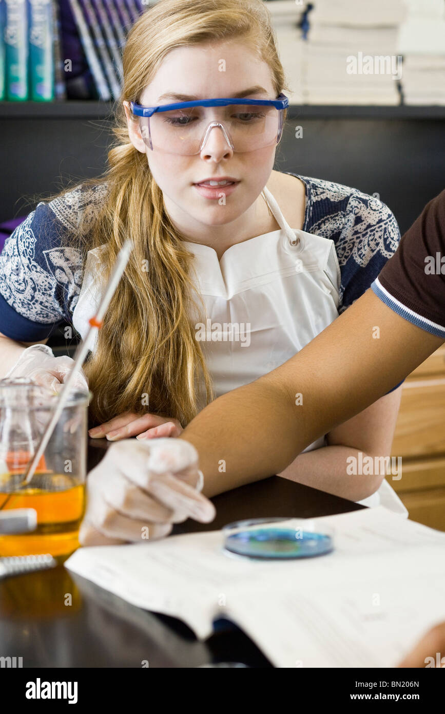 High school student conducting experiment in chemistry class Stock Photo Alamy