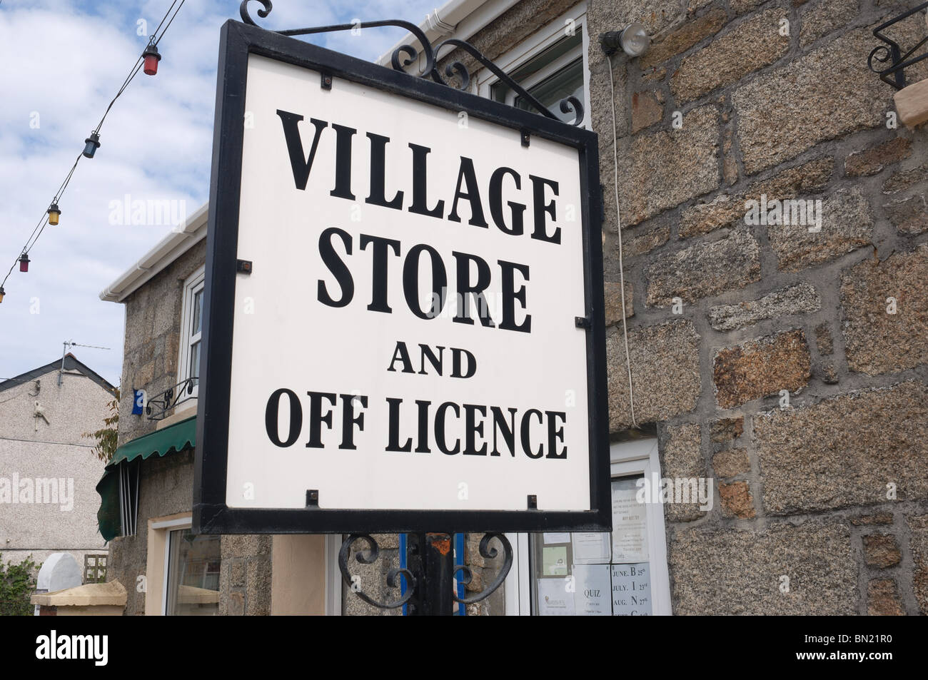 Village Stores Sign - John Gollop Stock Photo