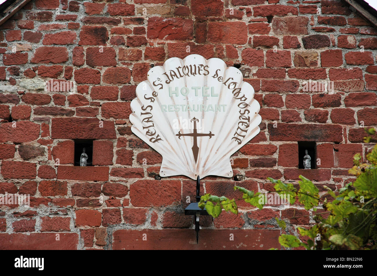 Scallop shell sign on a Hotel in Collonges-la-Rouge, France. Stock Photo