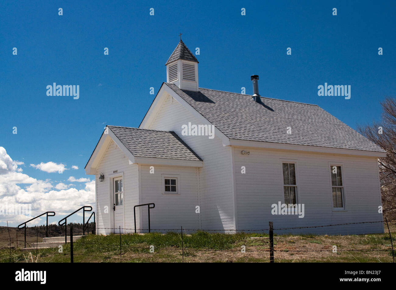 Old historic wooden white clapboard church in Virgina Dale Colorado Stock Photo