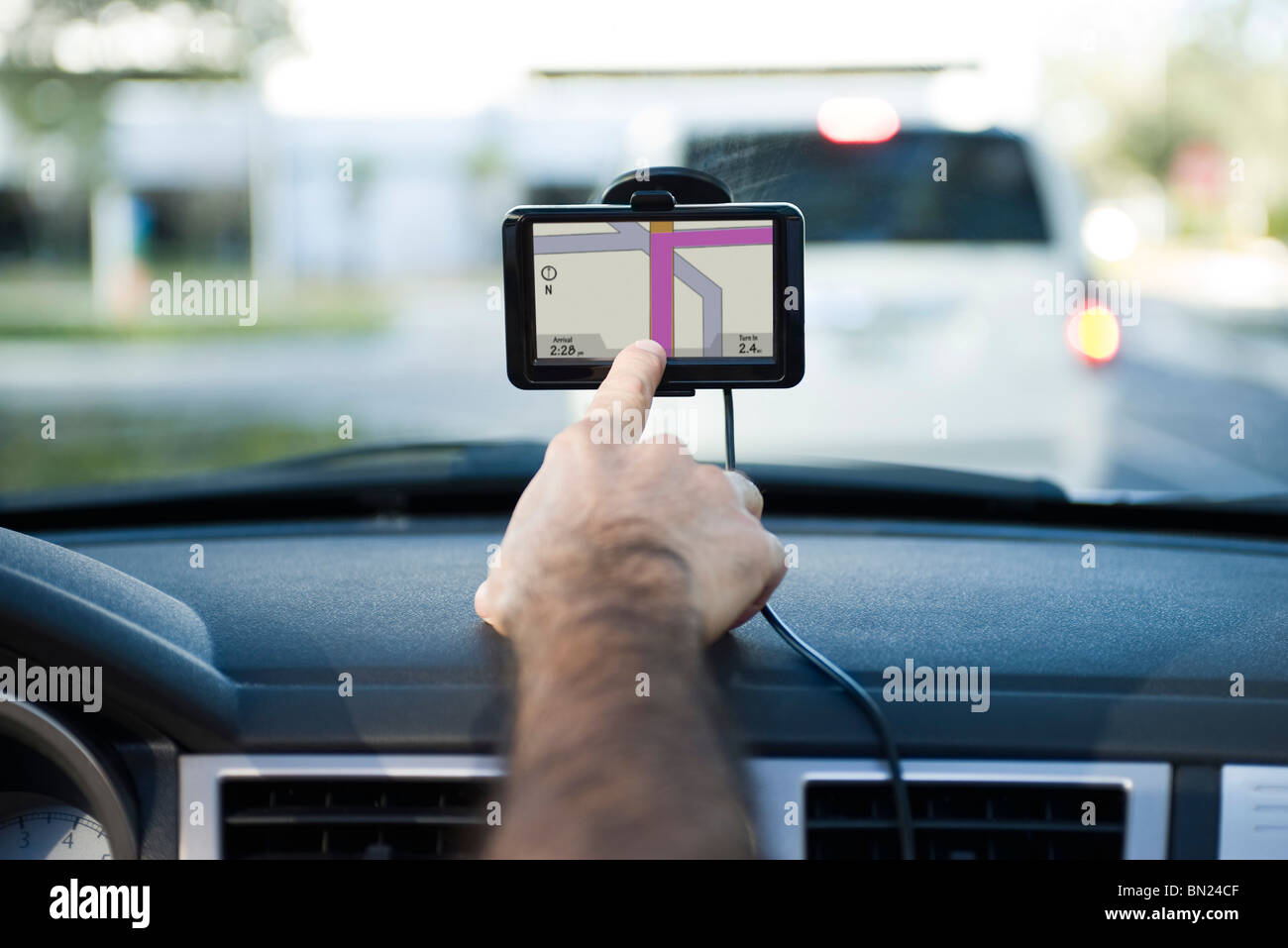 Driver using GPS unit Stock Photo Alamy