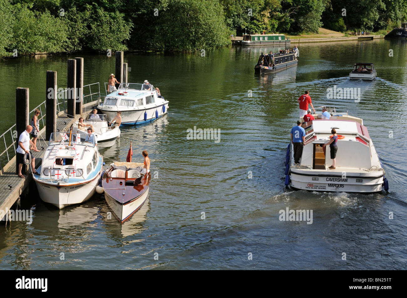 Leisure boats on moorings downstream of Boulters Lock River Thames