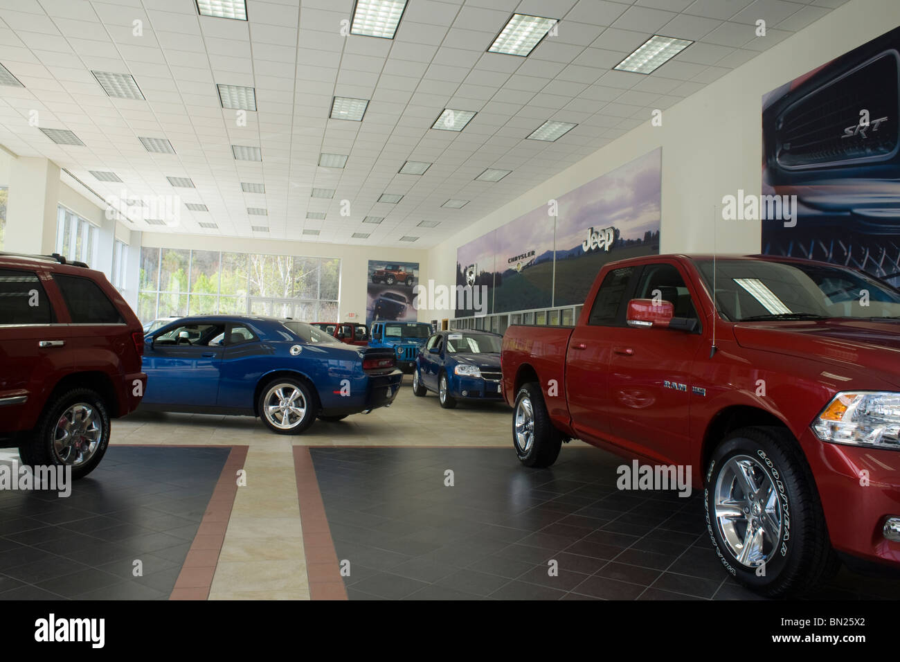 Massachusetts car dealer is selling Chevrolet and Dodge automobiles. Stock Photo