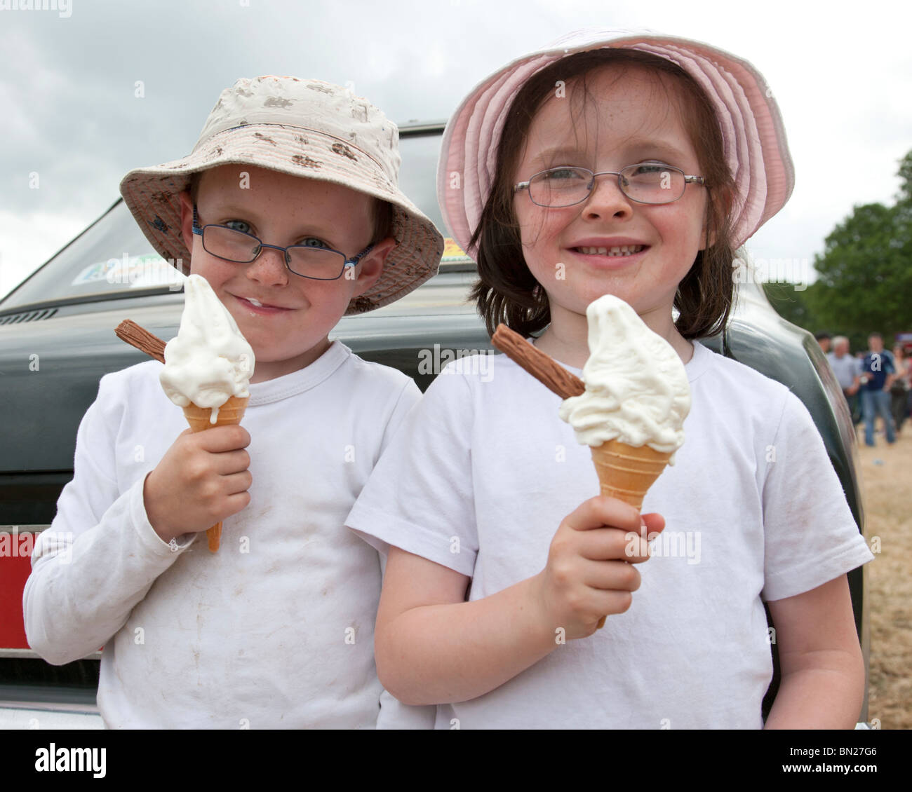 Two children eating ice cream cones, Ireland Stock Photo