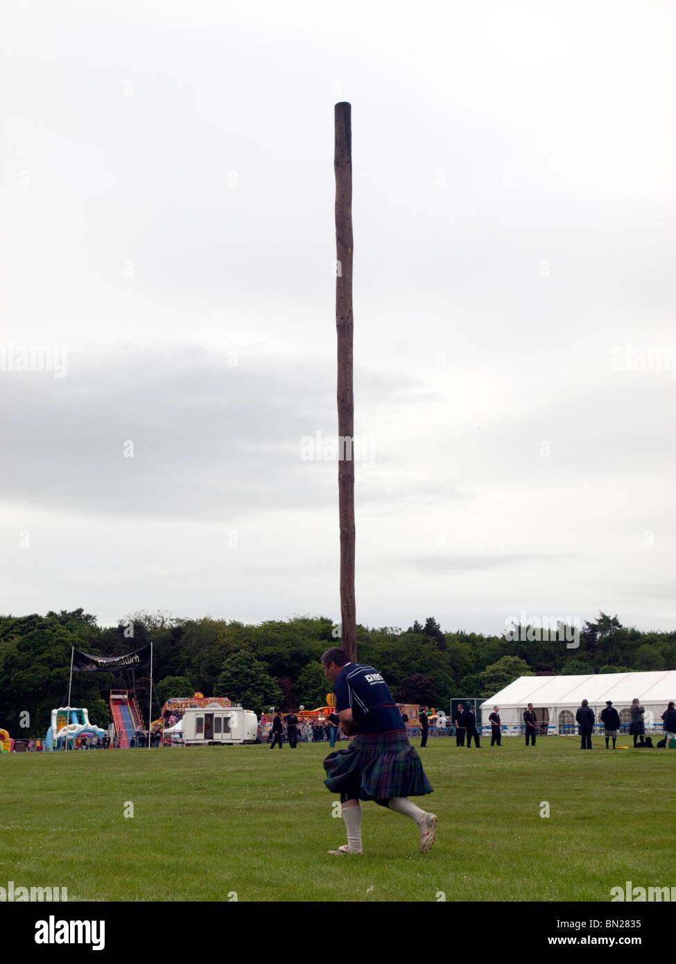 Aberdeen, Scotland - June 20th 2010: Competitor performing a caber toss ...