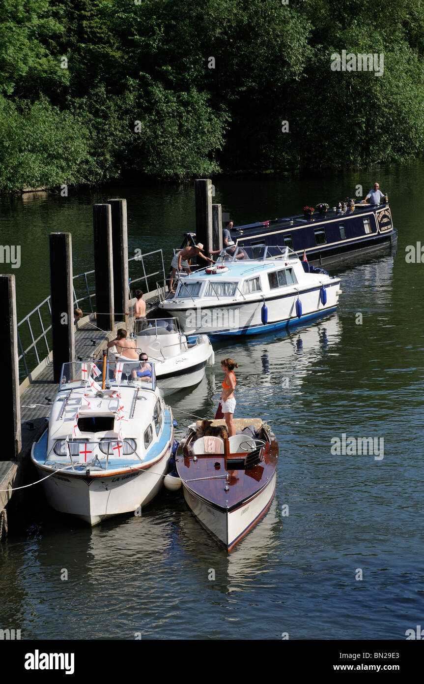 Leisure boats on moorings downstream of Boulters Lock River Thames