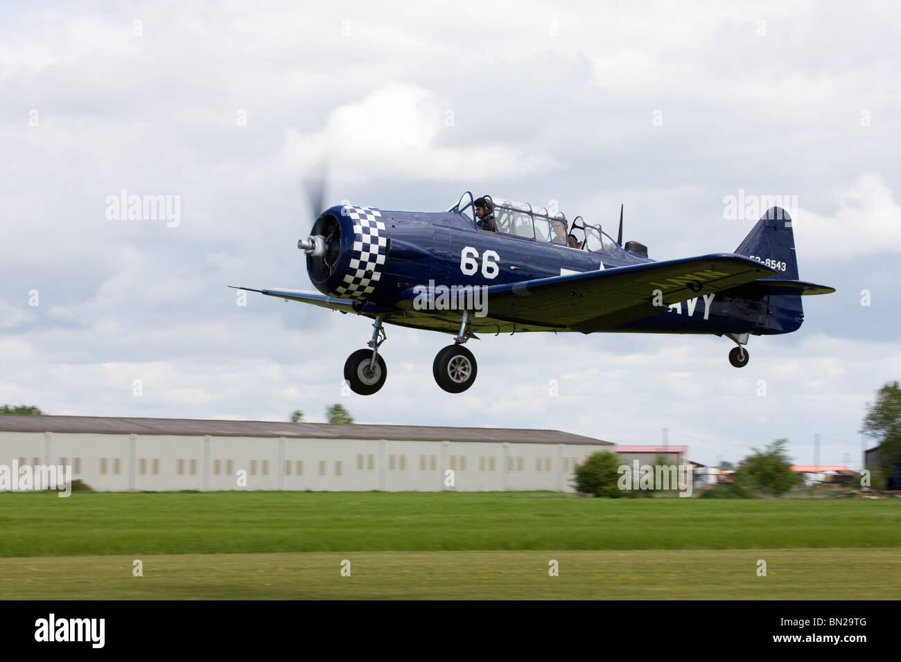 North American T6J Harvard 52-8453 66 Navy G-BUKY taking-off from Breighton Airfield Stock Photo