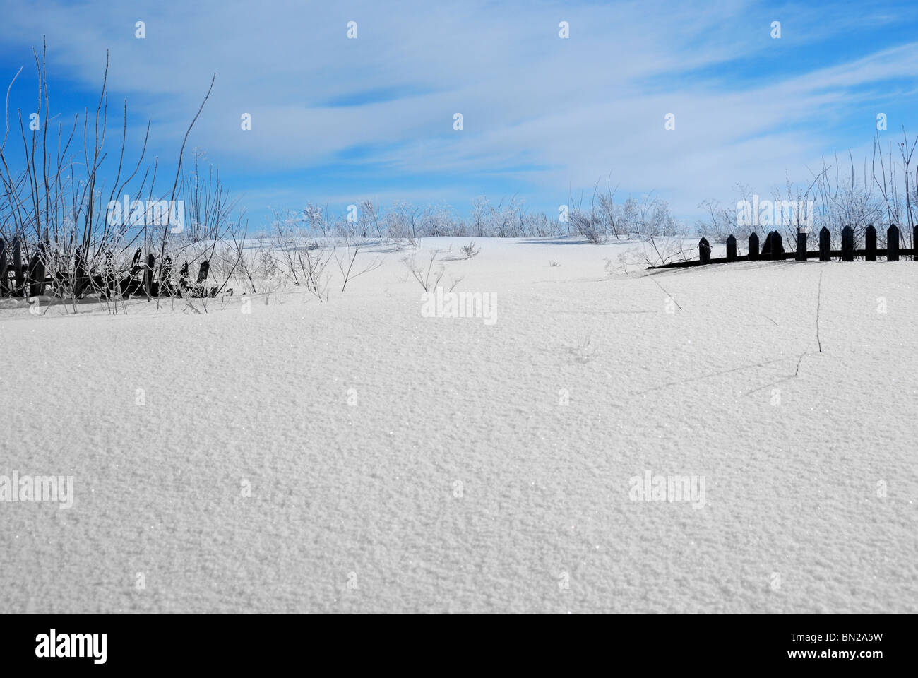 Wooden fence covered with snow Stock Photo - Alamy