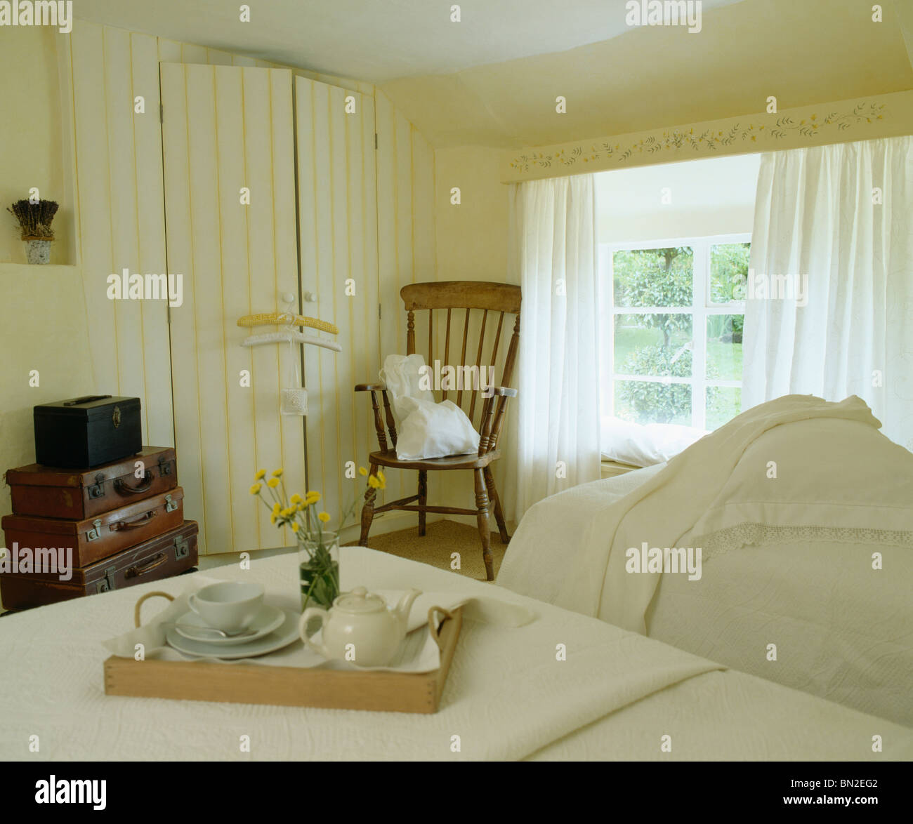 Twin Beds In Bedroom With Breakfast Tray In Cream Country