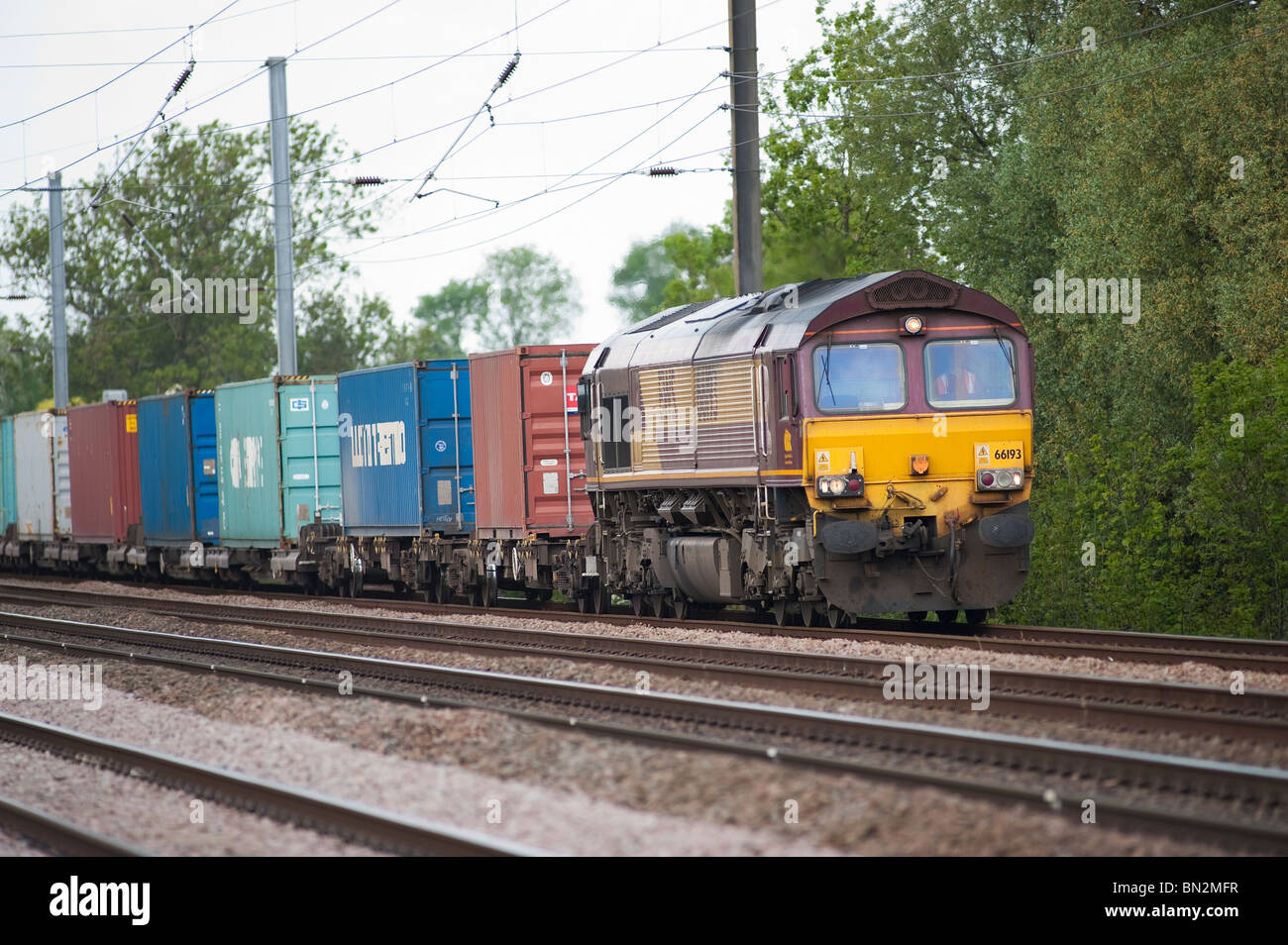 English welsh and scottish railways class 66 locomotive hauling freight containers on a freight train on the english railway. Stock Photo