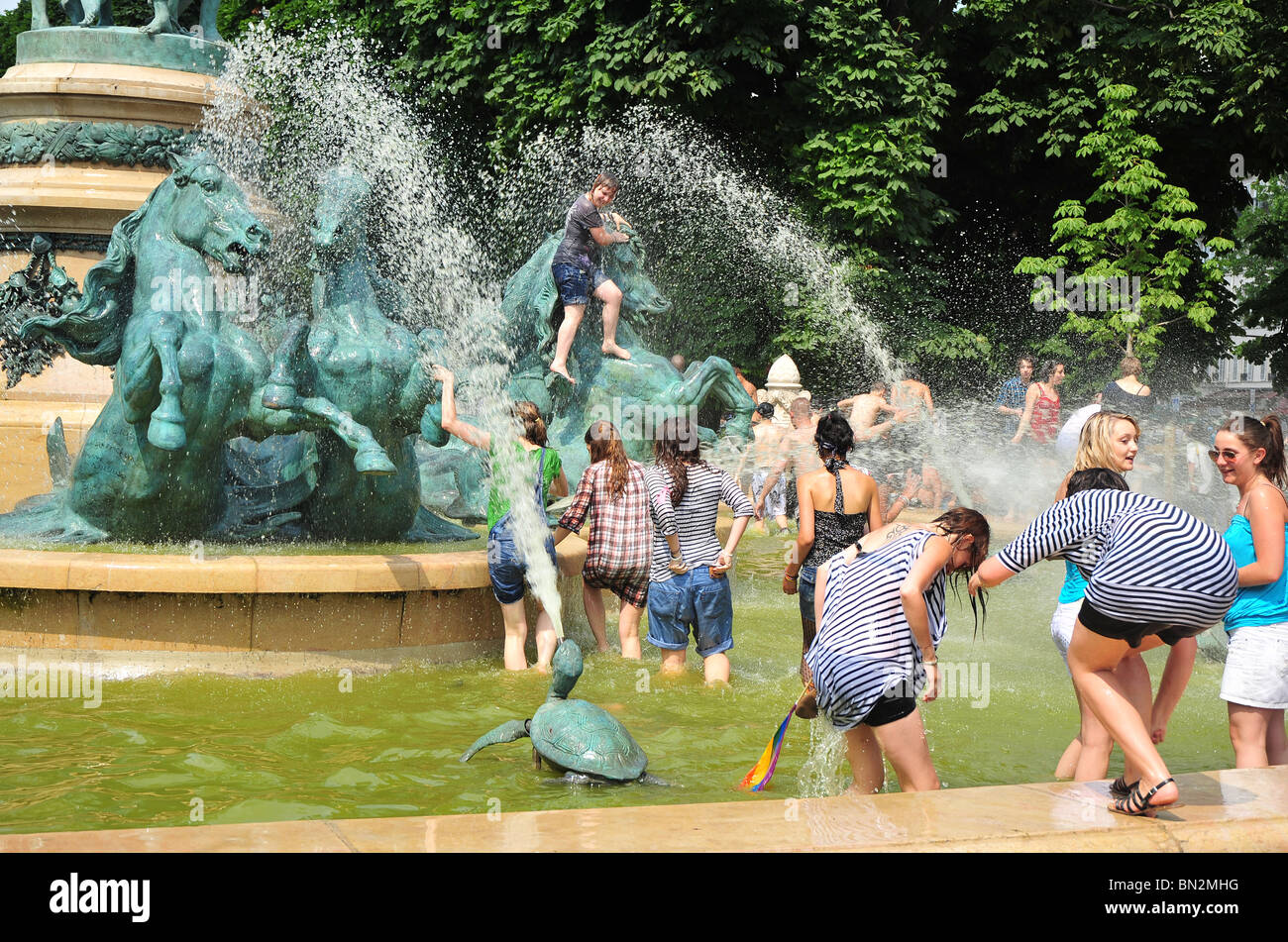 teenagers bathing in a fountain, Paris Stock Photo - Alamy