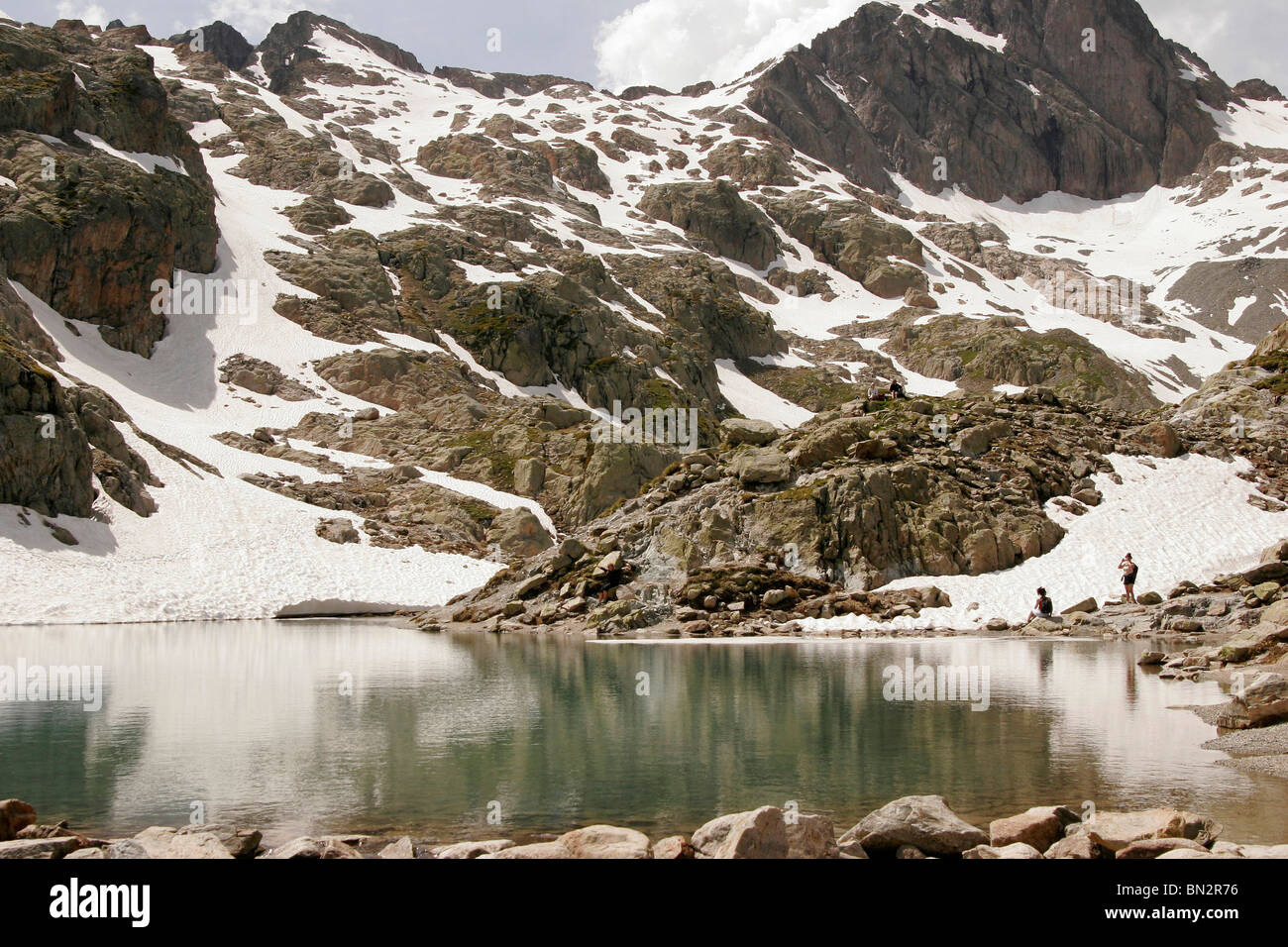 Tourists on Lac Blanc Lake, in the Mont Blanc Massif, near Chamonix-Mont-Blanc, France, Europe Stock Photo