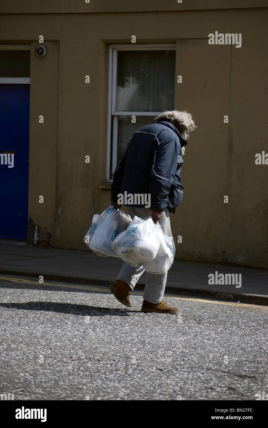 Down-and-out man/tramp/hobo crossing a road in Edinburgh, Scotland Stock  Photo - Alamy