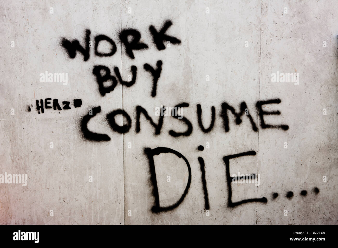 Work buy consume die graffiti at Glastonbury Festival, UK Stock Photo