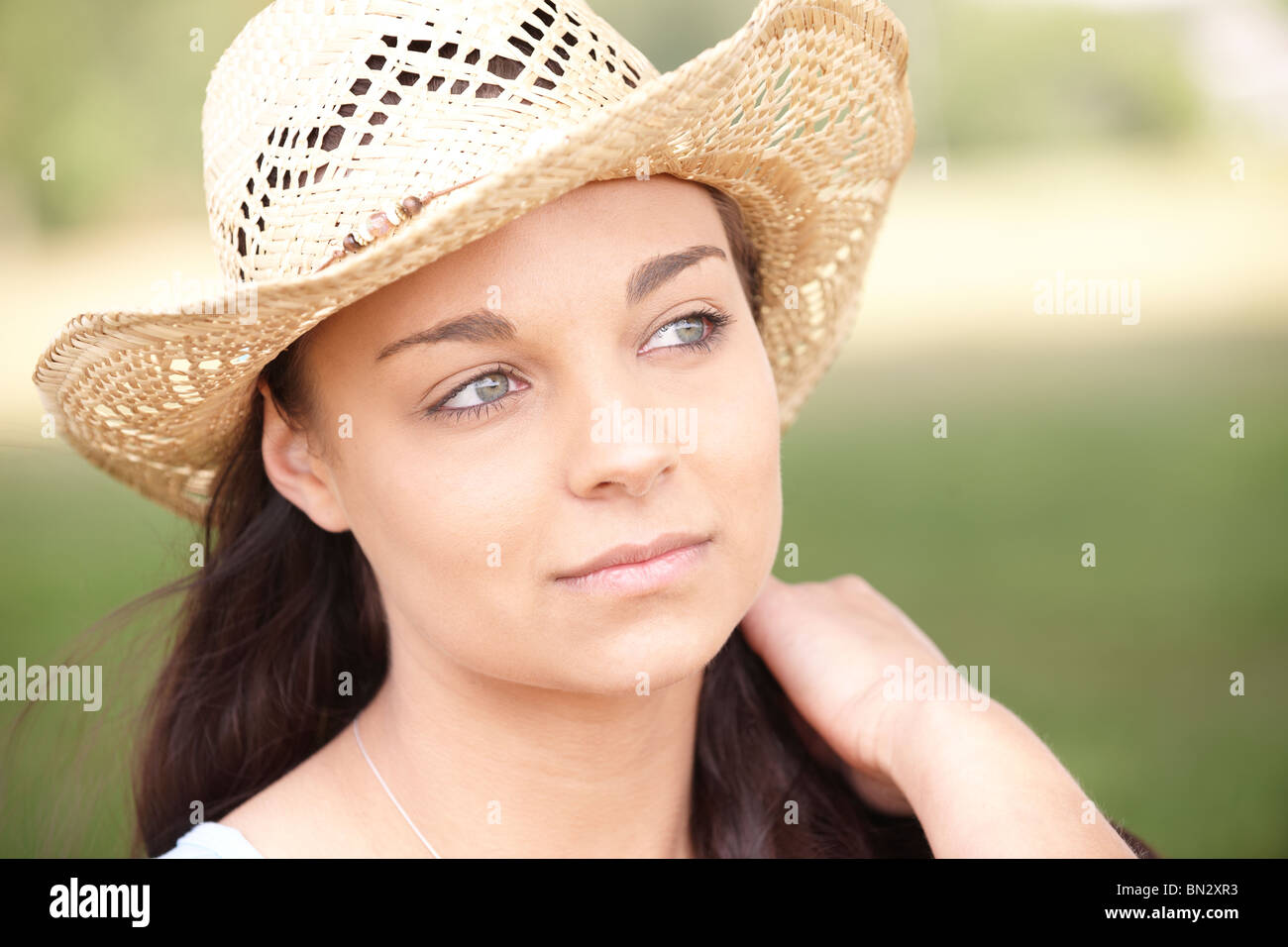 portrait of thoughtful attractive young woman wearing straw hat Stock ...