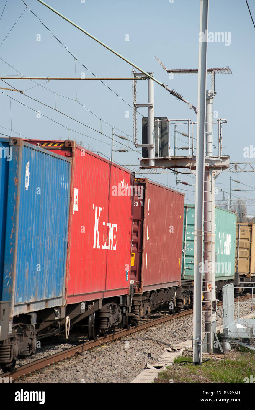 Freight containers on a train travelling along the english railway. Stock Photo