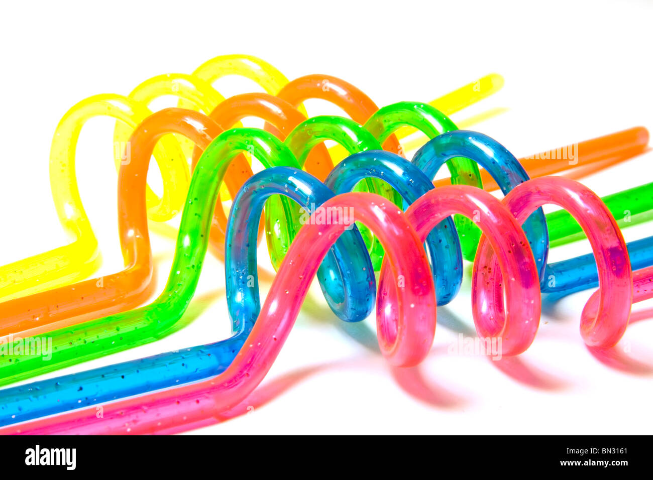 Five colored straws over white background Stock Photo