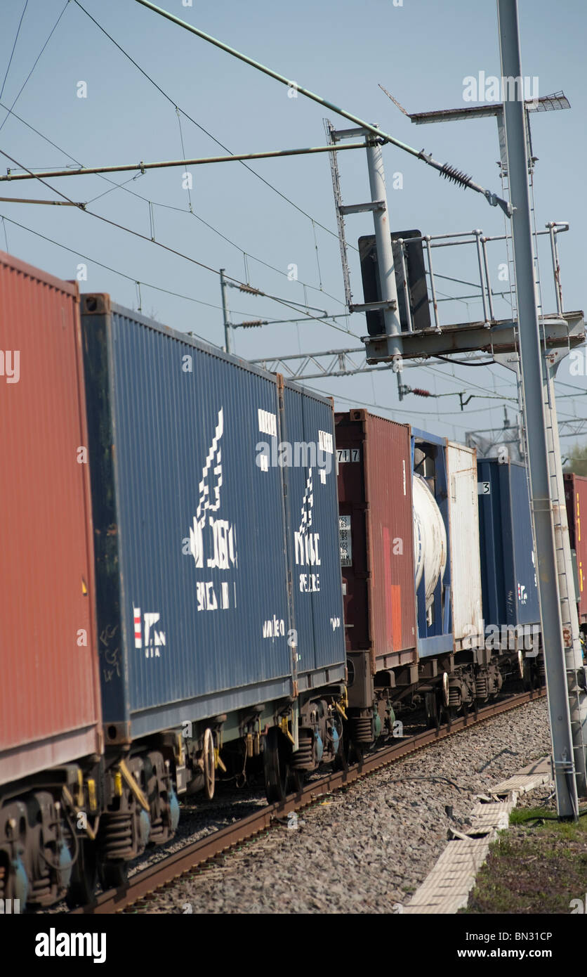 Freight containers on a train travelling along the english railway. Stock Photo