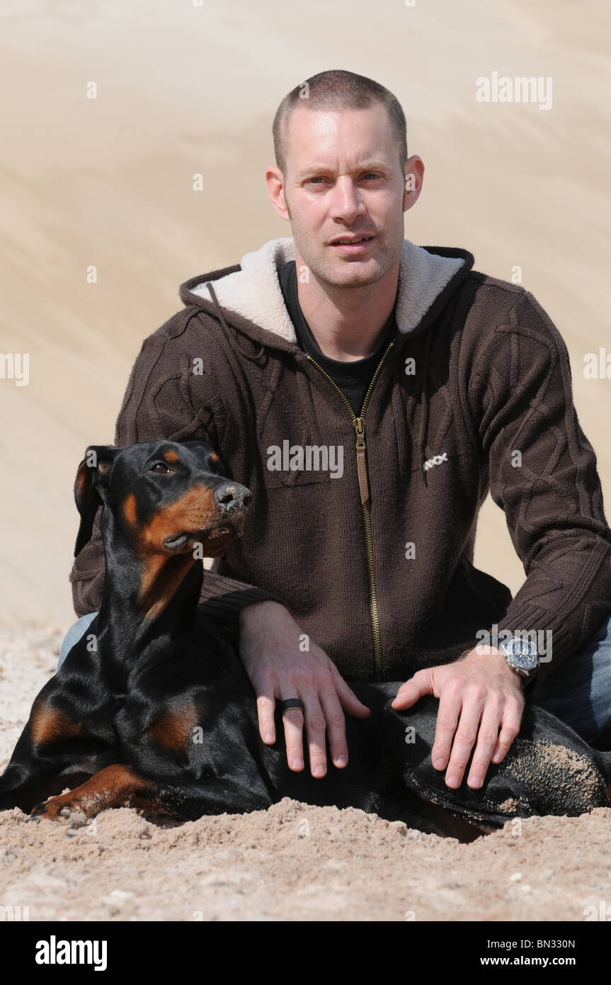 man with Doberman Stock Photo Alamy